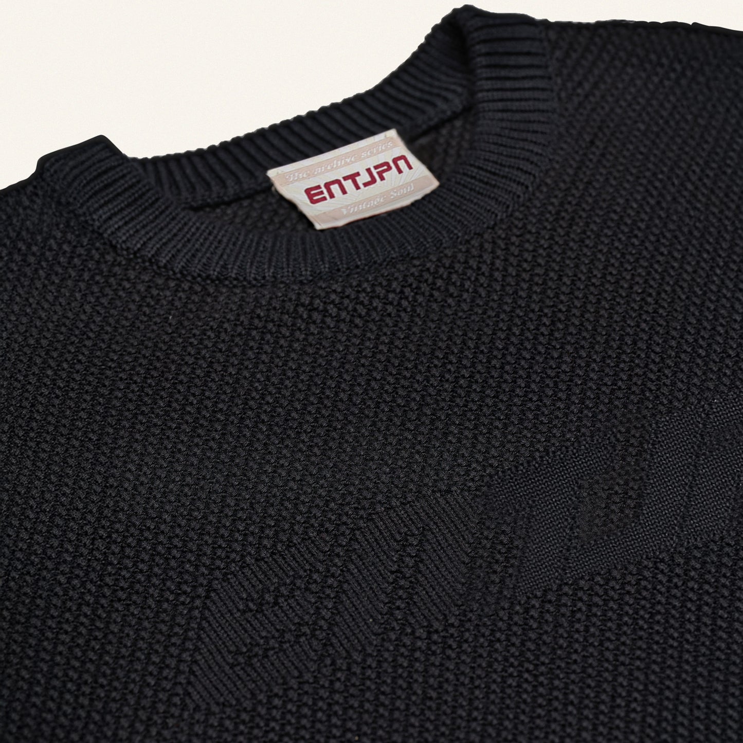 Maglione in cotone color nero con logo ENTJPN