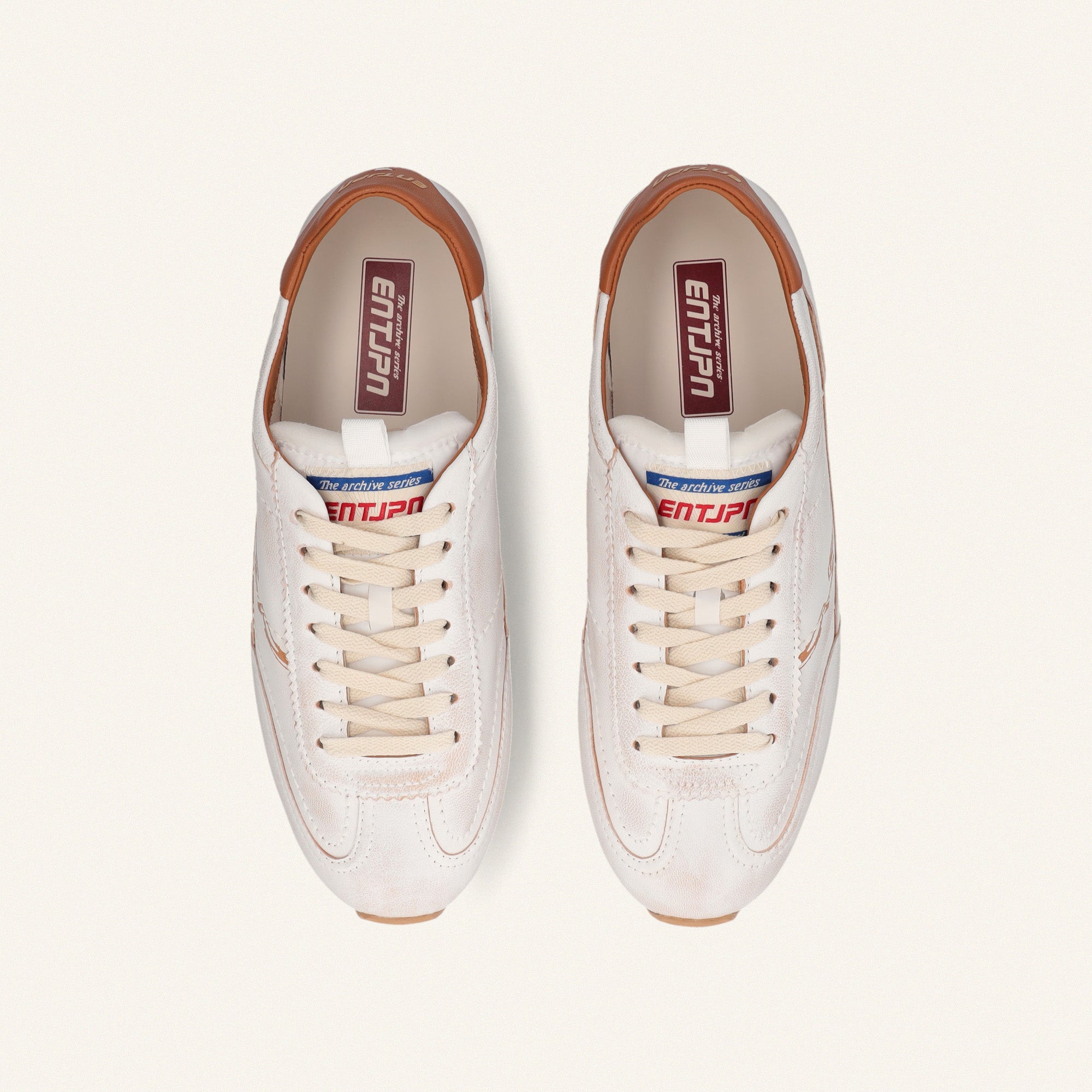 ENTJPN 61 – white leather sneakers with cognac details
