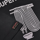 T-shirt in cotone nero con stampa 'Supermarket'