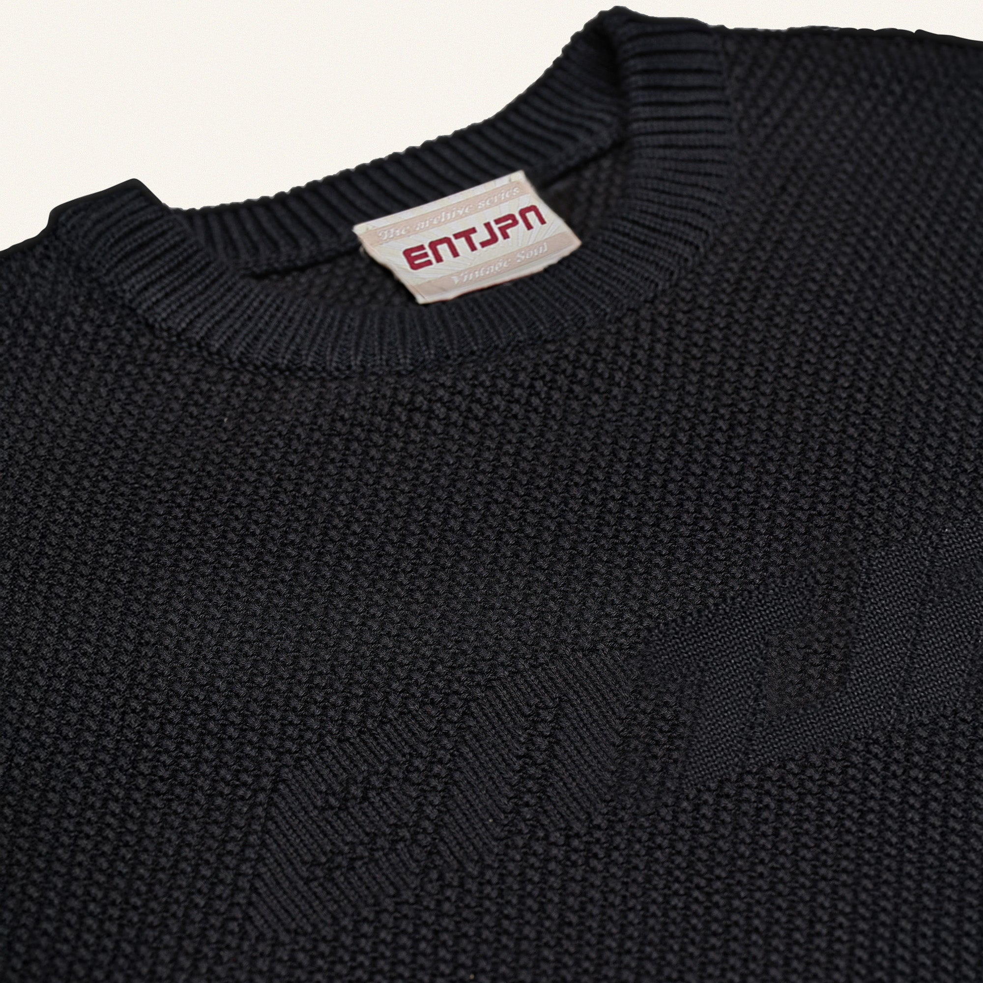 Maglione in cotone color nero con logo ENTJPN
