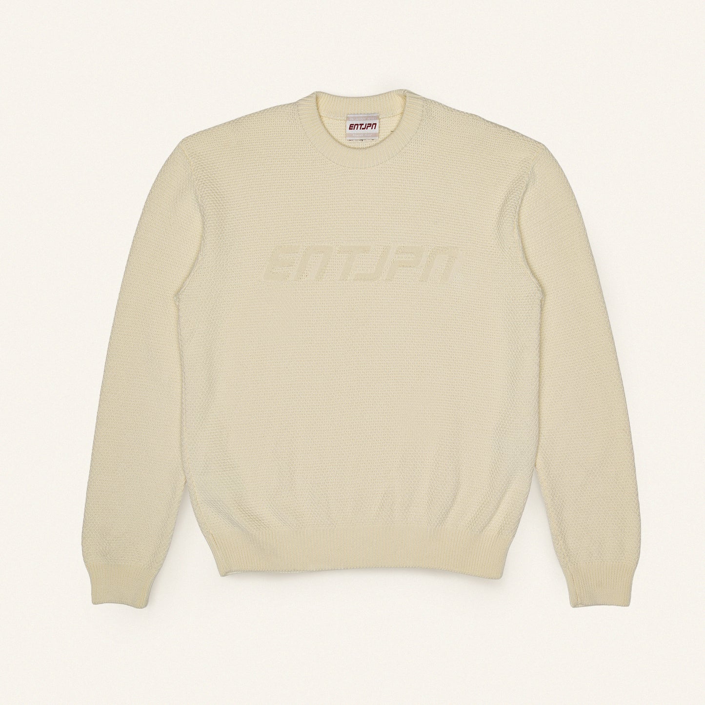 Maglione in cotone color burro con logo ENTJPN
