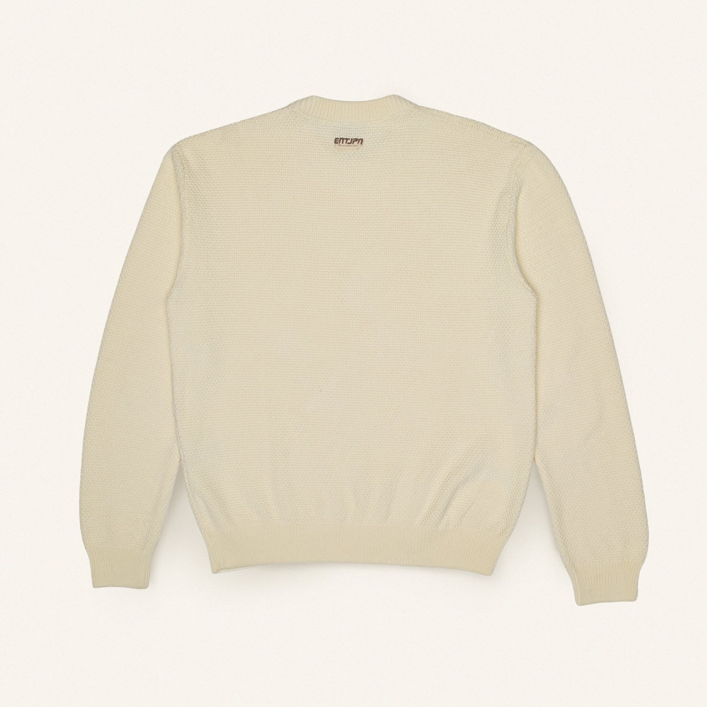 Maglione in cotone color burro con logo ENTJPN