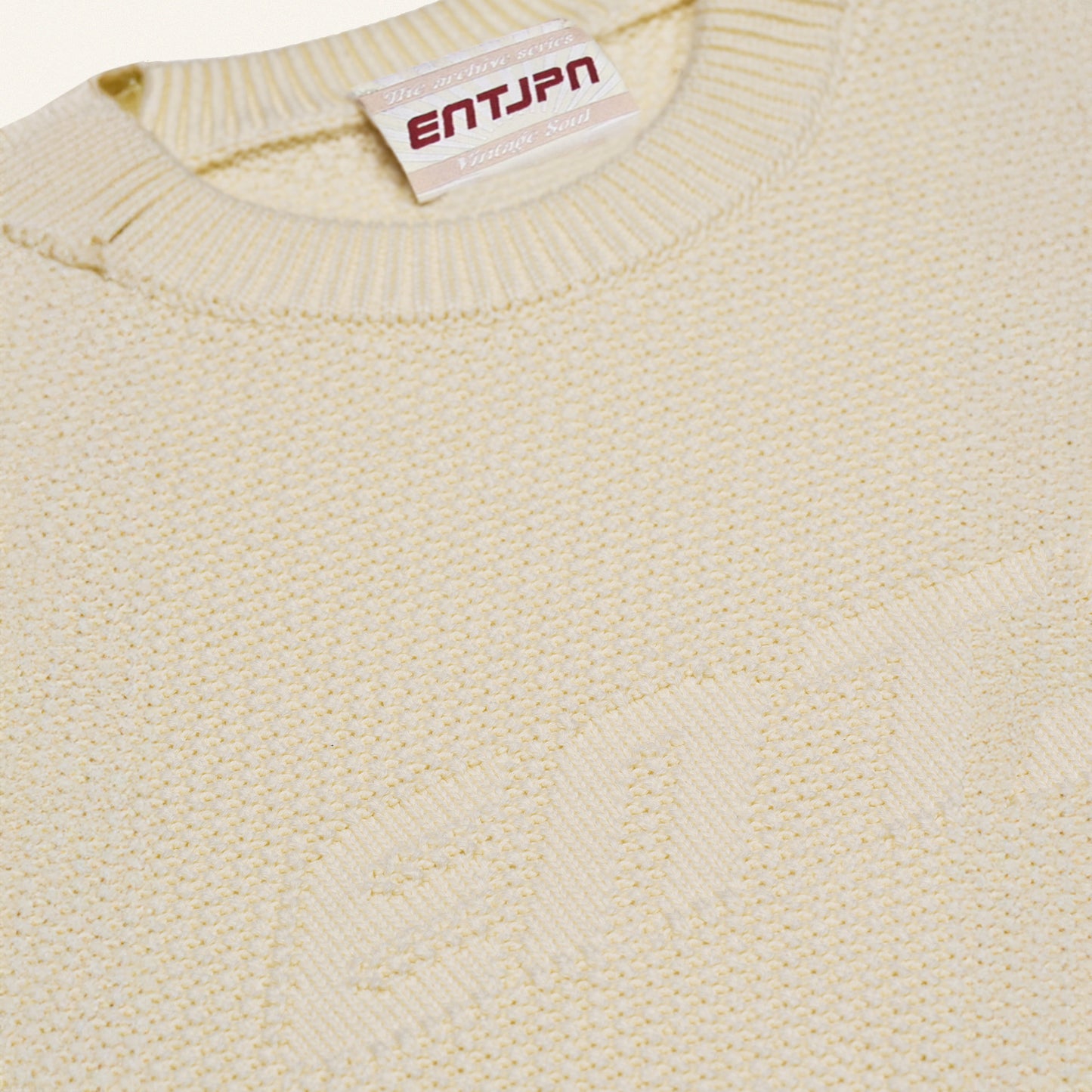 Maglione in cotone color burro con logo ENTJPN