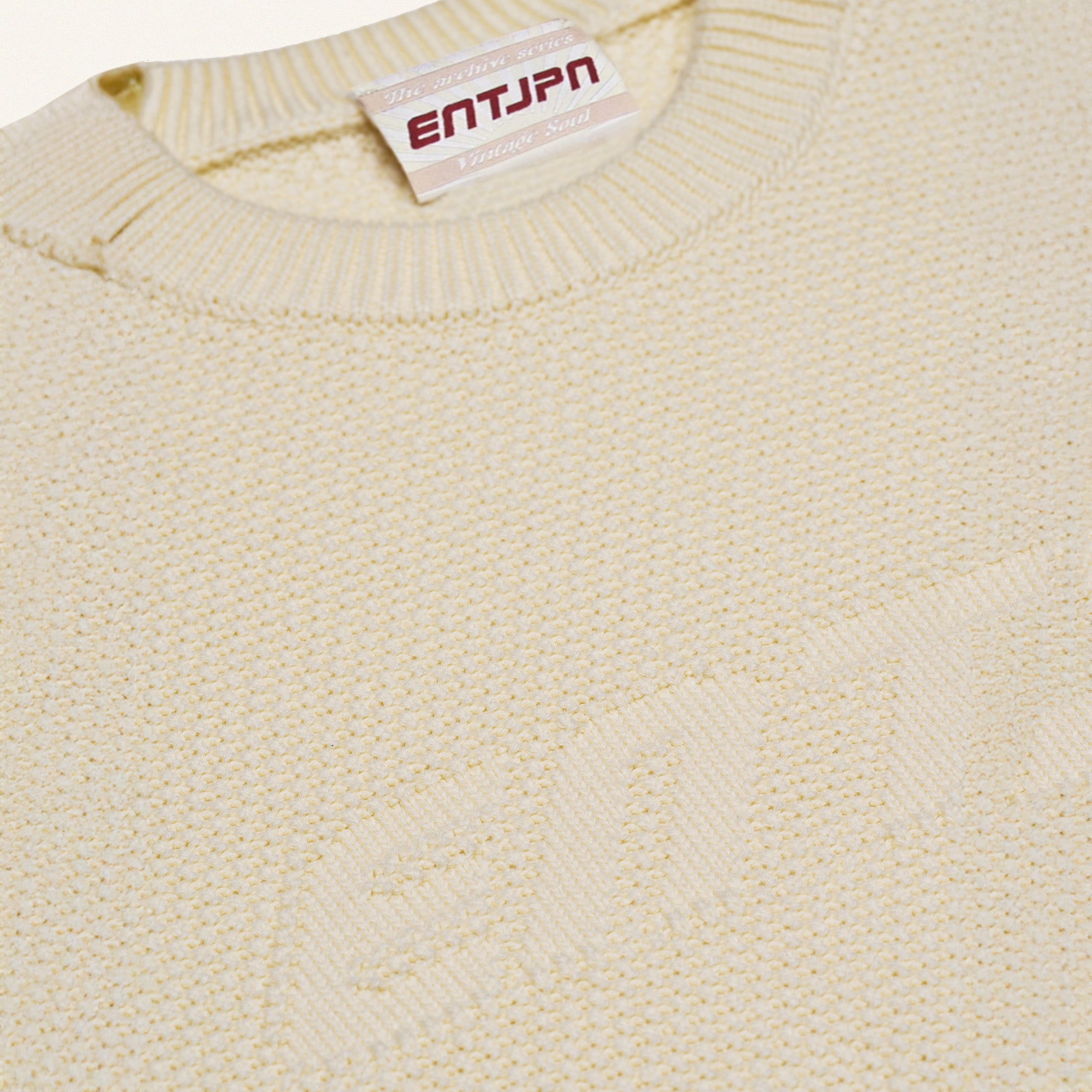 Maglione in cotone color burro con logo ENTJPN