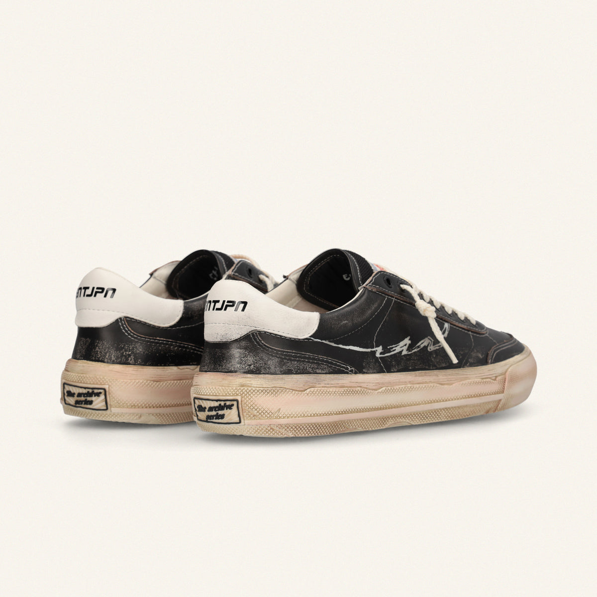  ENTJPN 75 – Black leather sneakers