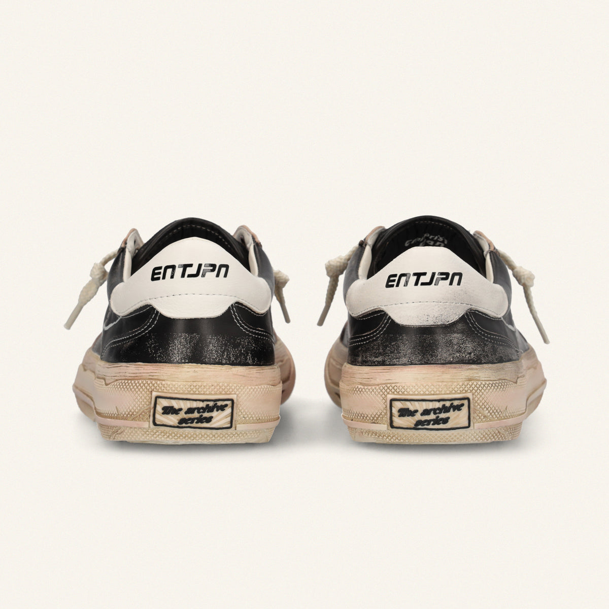  ENTJPN 75 – Black leather sneakers