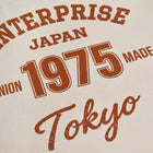 T-shirt in cotone color burro con stampa 'ENTJPN 1975 Tokyo'
